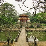 At Burial Site of Minh Mang  Hue was the capital of Vietnam during the reign of the Nguyen dynasty from beginning of 19th until mid of 20th century. The graves of the emperors are placed in various large and beautiful garden settings, spread along the Perfume River outside of the city.